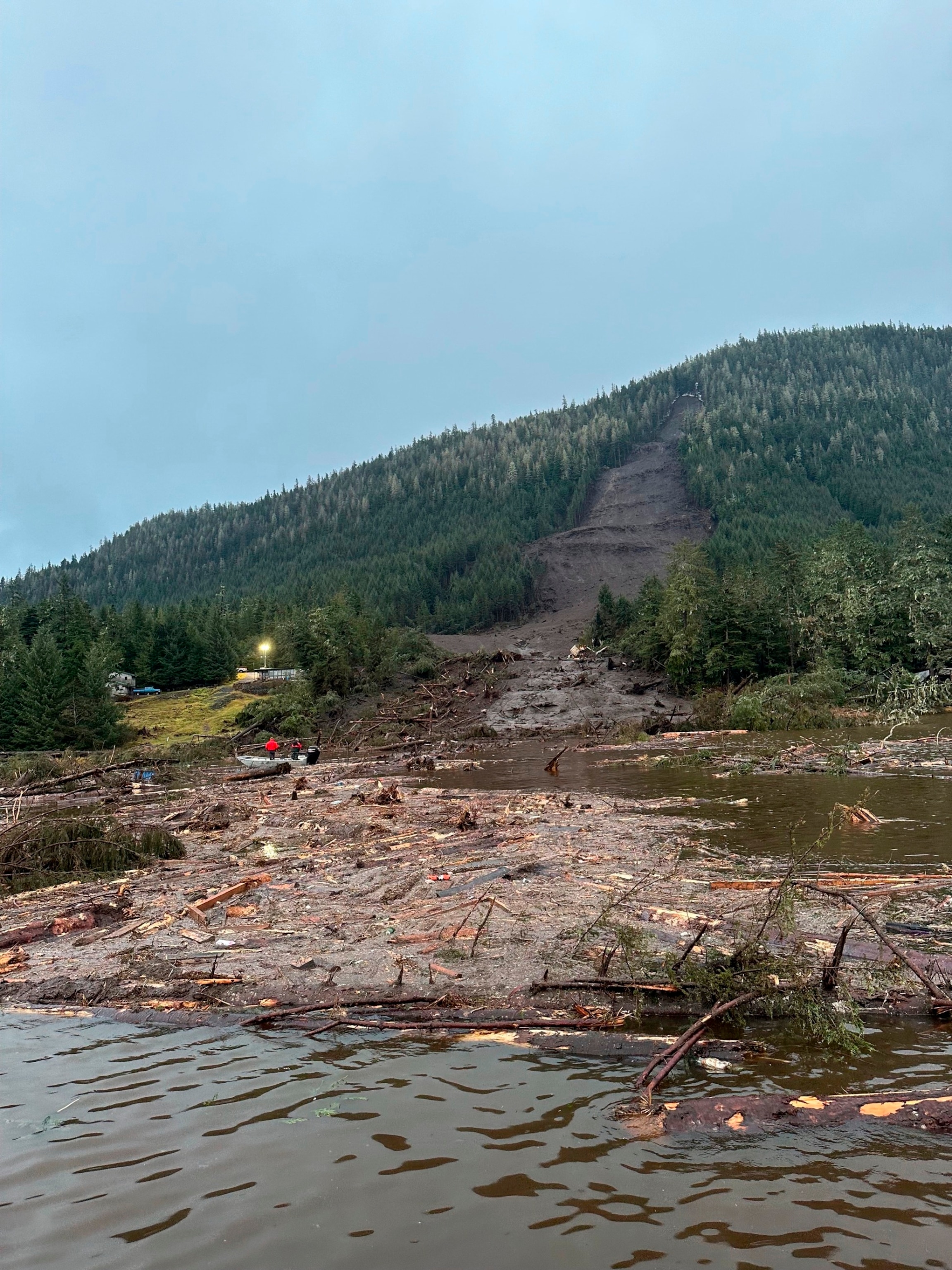 PHOTO: This photo provided by the Alaska Department of Public Safety shows debris from a massive landslide extends into the sea at mile 11 of the Zimovia Highway on Nov. 22, 2023, in Wrangell, Alaska. 