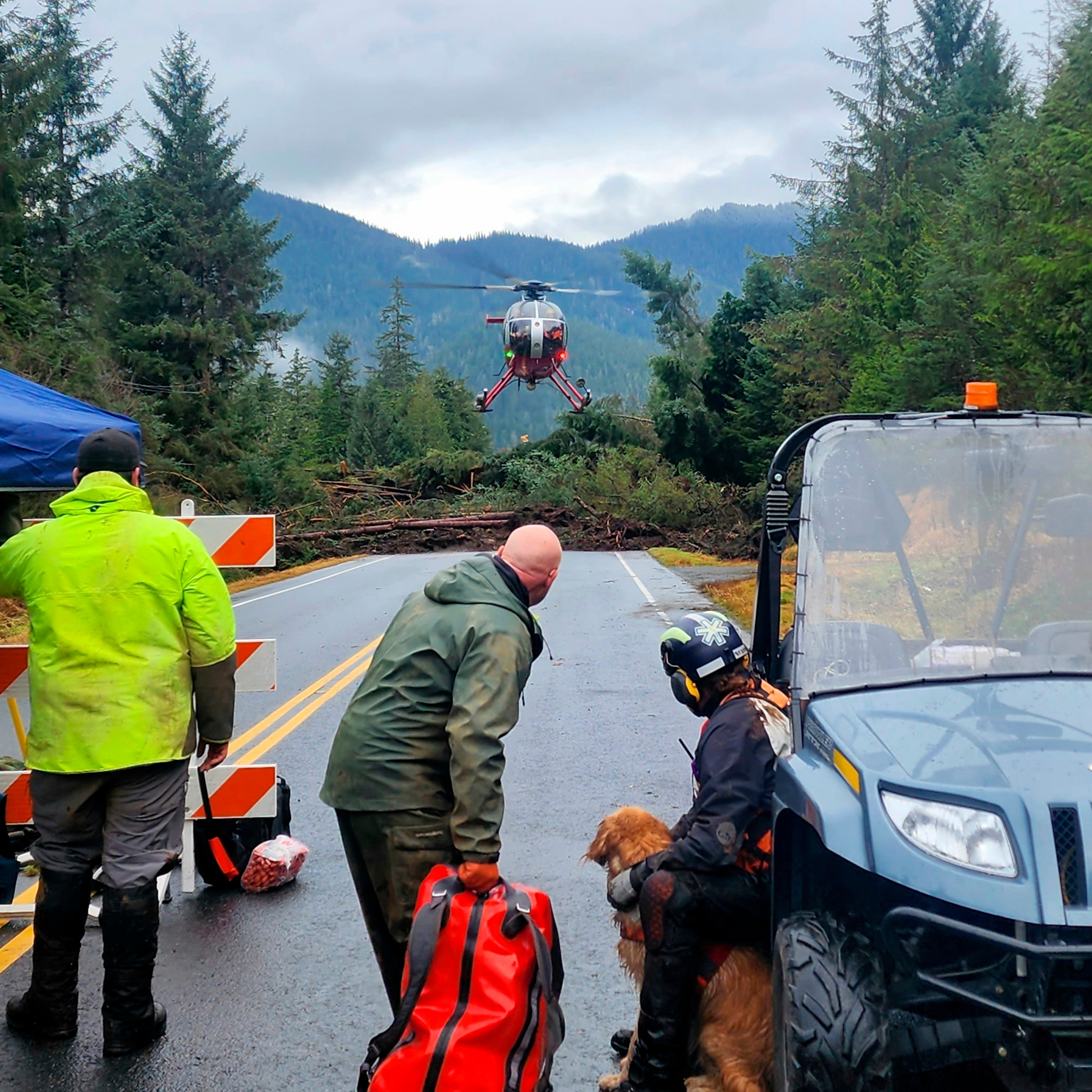 PHOTO: A helicopter arriving near mile 11 of the Zimovia Highway where ground teams are working to search areas that state geologists have determined safe for entry Nov. 22, 2023, in Wrangell, Alaska, following a massive landslide earlier in the week. 