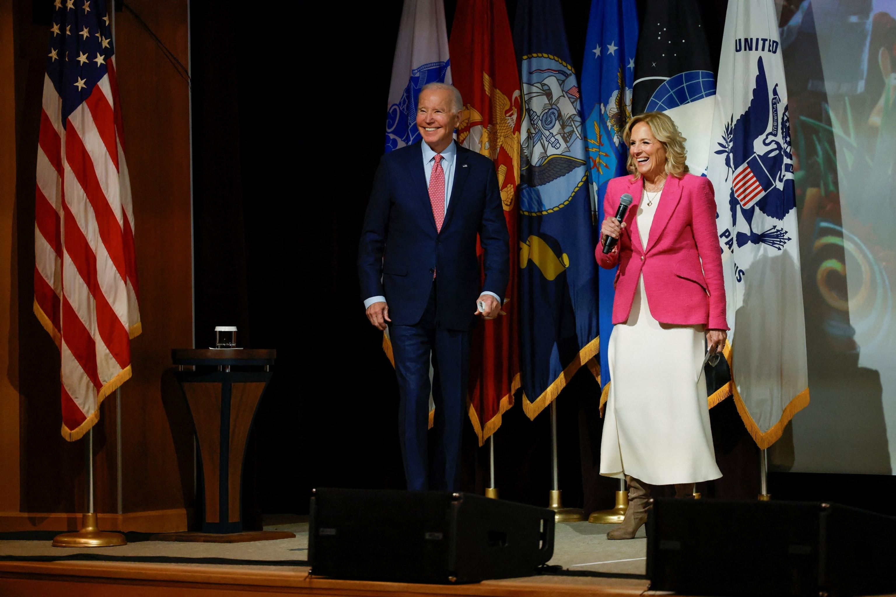 PHOTO: President Joe Biden and first lady Jill Biden react onstage as they attend a screening of "Wonka" at Norfolk Naval Station in Norfolk, Nov. 19, 2023.