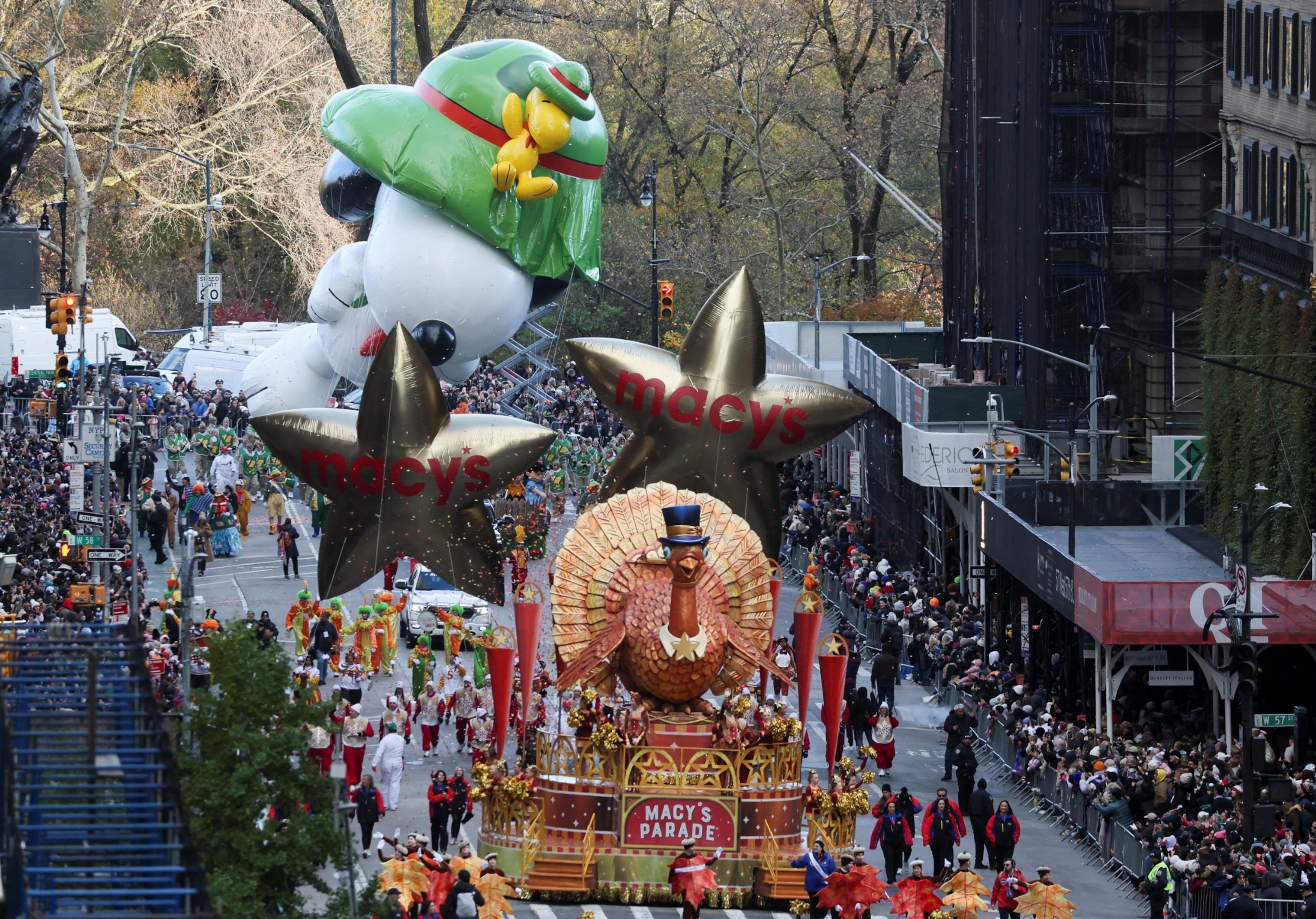 PHOTO: Beagle scout Snoopy balloon flies, as Tom Turkey float rides during the 97th Macy's Thanksgiving Day Parade in Manhattan, New York City, Nov. 23, 2023. 