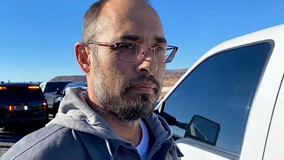 This photo posted on the Custer County Sheriff's Office Facebook page shows Hanme K. Clark as he's taken into custody by personnel from the New Mexico State Police and the U.S. Marshals Service, near Albuquerque, N.M., Tuesday, Nov. 21, 2023. Clark was captured after 25 hours on the run after police say he fatally shot three people and critically wounded a fourth in his latest property dispute with neighbors in rural Colorado, authorities said. (Courtesy of Custer County Sheriff's Office via AP)