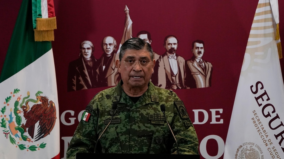 FILE - Mexican Defense Secretary Luis Cresencio Sandoval announces the arrest of Ovidio during a press conference in Mexico City, on Jan. 5, 2023. The U.S. government thanked Mexico for arresting a hyper violent alleged Sinaloa cartel security chief, but according to details released Friday, Nov. 24, 2023 the arrest of suspect Nestor Isidro Pérez Salas this week may have been highly personal for the Mexican army. Sandoval said Pérez Salas had ordered a 2019 attack on an unguarded apartment complex where soldiers’ families lived. (AP Photo/Eduardo Verdugo, File)